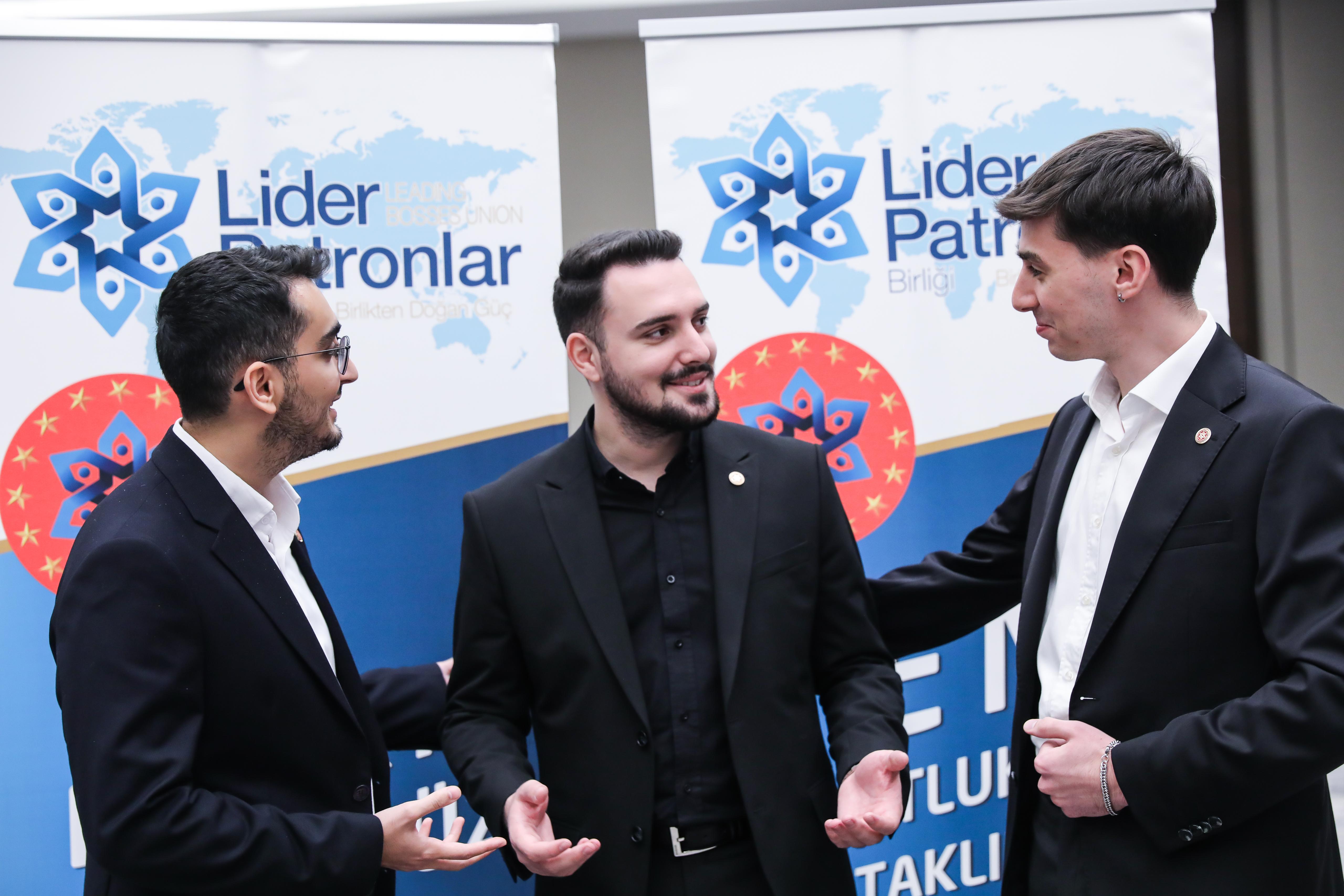Three men in suits at a Lider Patronlar event